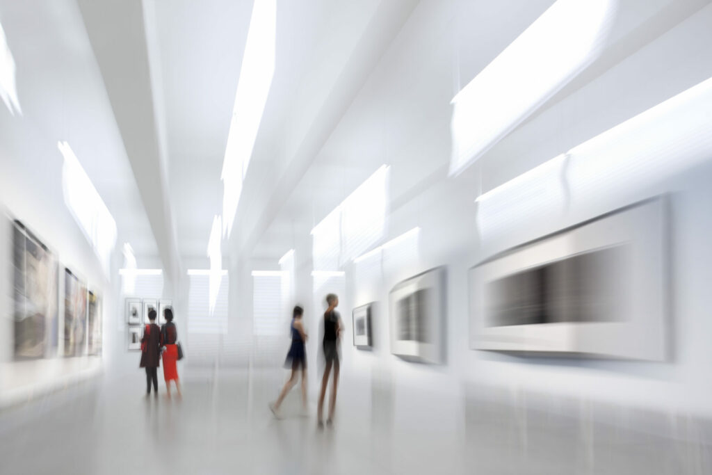 abstract image of people in the lobby of a modern art center with a blurred background